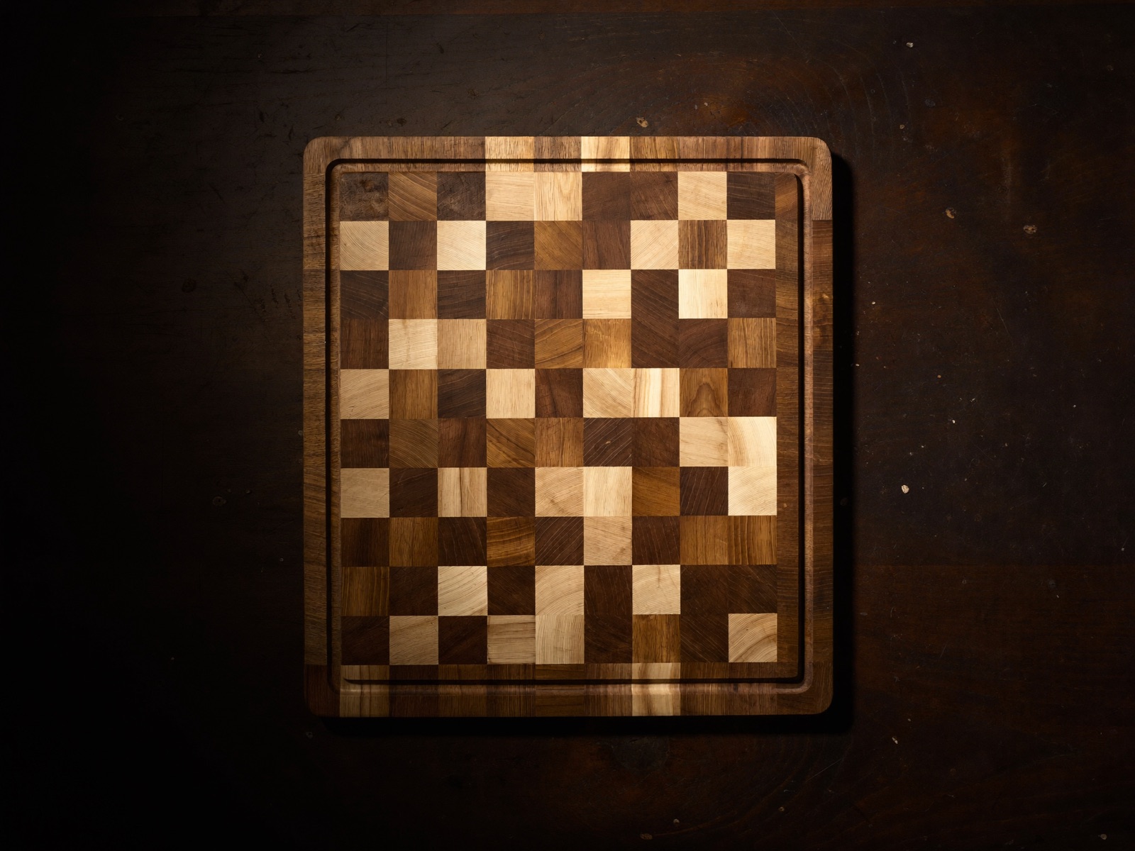The Compact seen square-on from above: a fine end-grain mosaic inside a mitred walnut border.